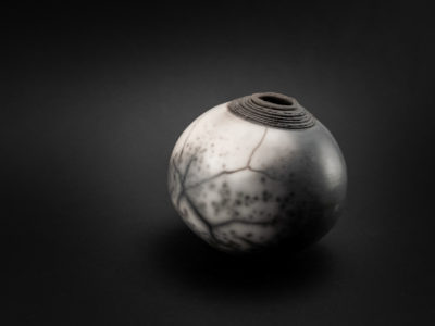 Dirty Snowball: Naked Raku Whispering Globe - Ildikó Károlyi